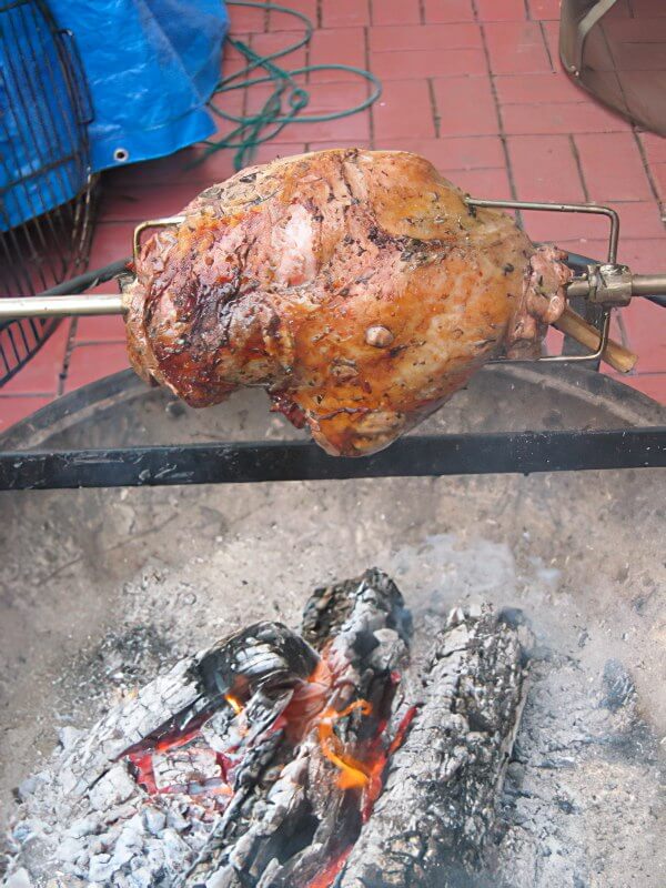 fire pit barbecue rotisserie lamb
